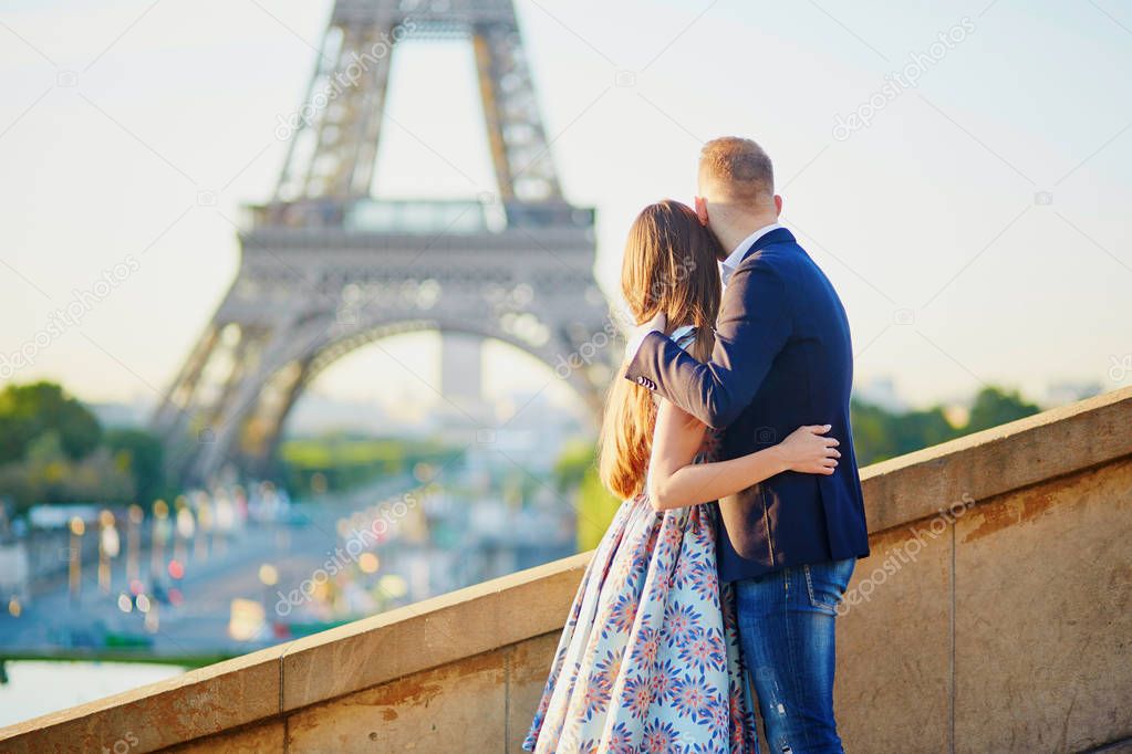 Romantic couple near the Eiffel tower in Paris, France