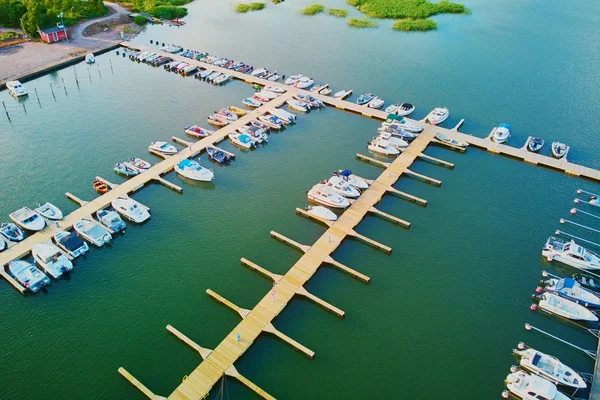 Aerial view of colorful boats near wooden berth in the countryside of Finland — ストック写真