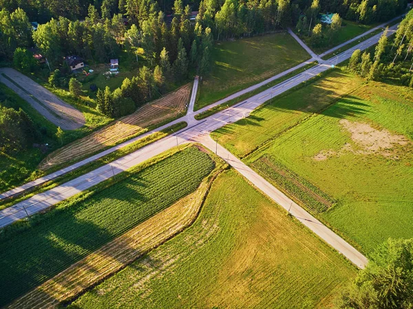 Aerial view of road surrounded by forest in countryside of Finland, Northern Europe — Stock Photo, Image