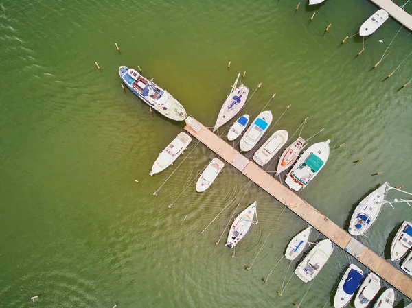 Top down view of colorful boats near wooden berth in the countryside of Finland — Stock Photo, Image