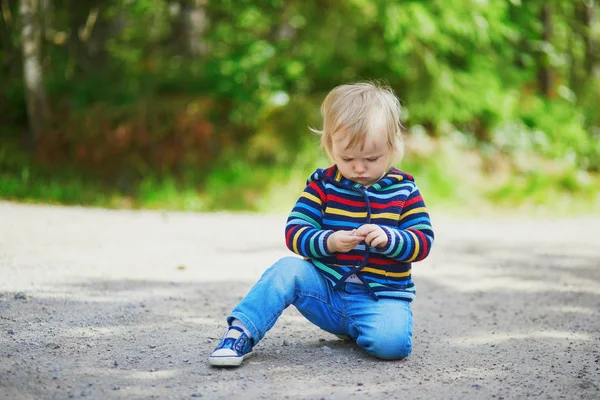 Adorable Baby Girl Forest Sitting Ground Playing Little Stones Little — Stock Photo, Image