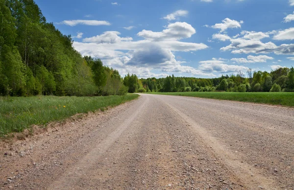 Onverharde weg in platteland. — Stockfoto