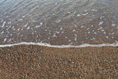 Kumlu plaj arka plan dalga yumuşak.