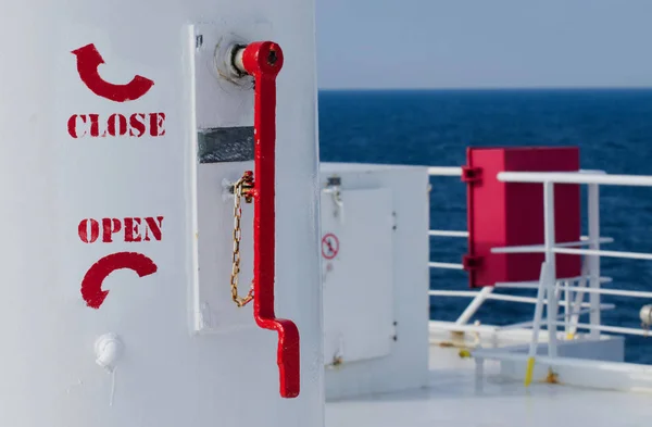 Close and open rotate red signs on the upper deck of passenger ship — Stock Photo, Image