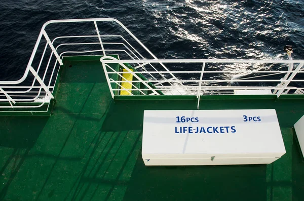 Two white boxes with life jackets on deck of passenger liner — Stock Photo, Image