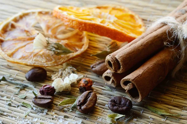 Spa still life - cinnamon,coffee beans,salt,dried orange,lemon pieces,haws and lavender leaves — Stock Photo, Image
