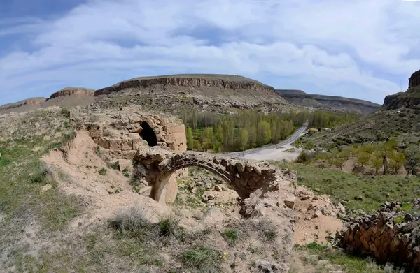 View from abandoned ruined christian church to road on Mazy, n Cappadocia, Turkey — стоковое фото