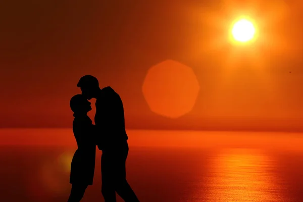 Silhouet jongen en meisje op een mooie zonsondergang hand in hand — Stockfoto