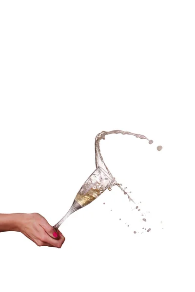 Női kéz elszigetelt üveg pezsgő splash — Stock Fotó
