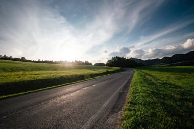 Road in mountain valley at sunny morning in Poland.