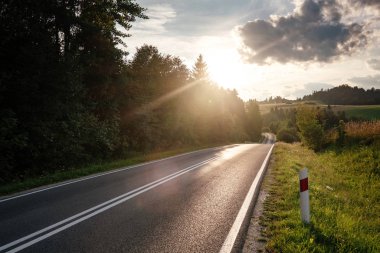 Road in mountain valley at sunny morning in Poland.