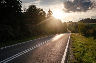 Road in mountain valley at sunny morning in Poland.