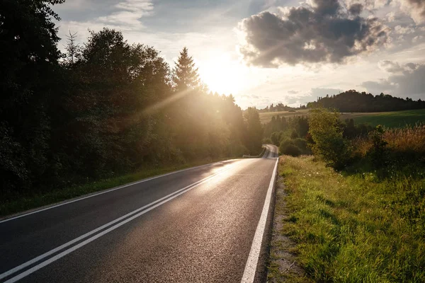 Road in mountain valley at sunny morning in Poland.