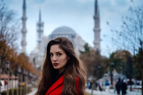 Latin American woman or Turkish woman in a red stylish coat — 스톡 사진