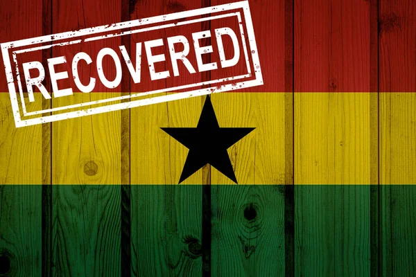 flag of Ghana that survived or recovered from the infections of corona virus epidemic or coronavirus. Grunge flag with stamp Recovered