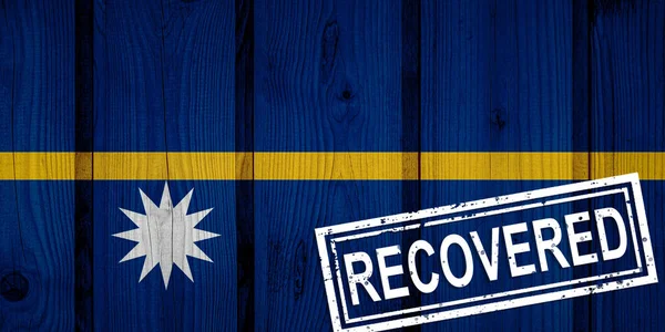 flag of Nauru that survived or recovered from the infections of corona virus epidemic or coronavirus. Grunge flag with stamp Recovered