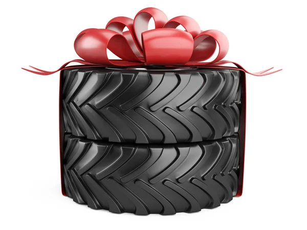 Big tire with red bow and ribons. Heavy equipment vehicle. — Stock Photo, Image