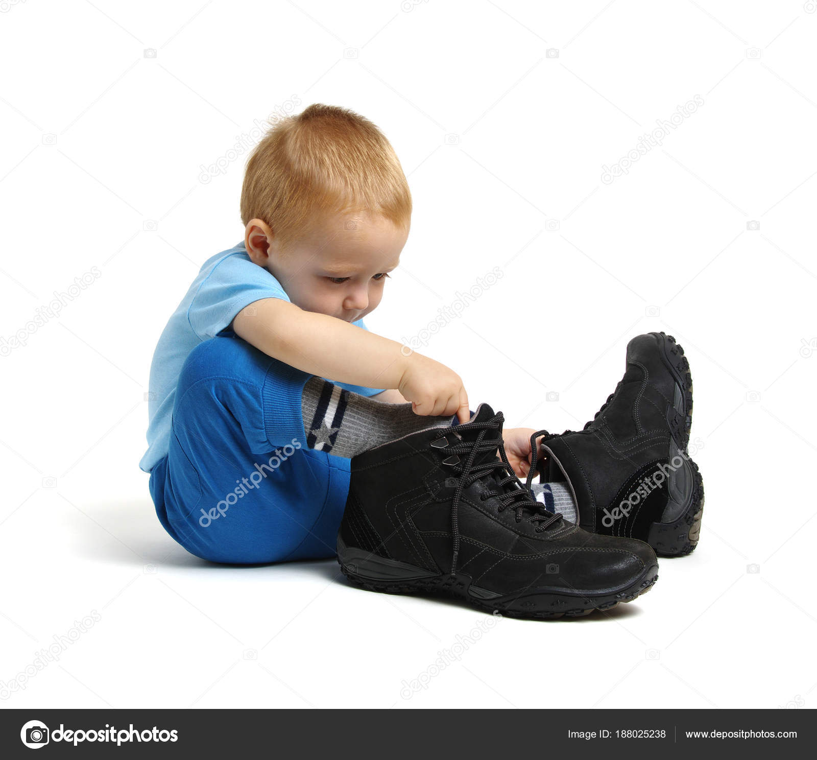 Boy in father's shoes Stock Photo by ©Aleks 188025238