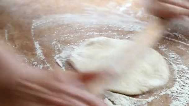 Baker rolls out the dough — Stock Video
