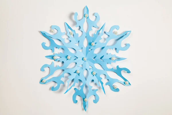 Fine paper snowflake cut out. — Stock Photo, Image