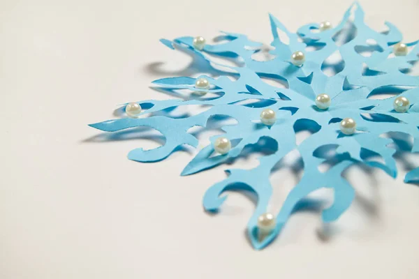 Fine paper snowflake cut out. — Stock Photo, Image