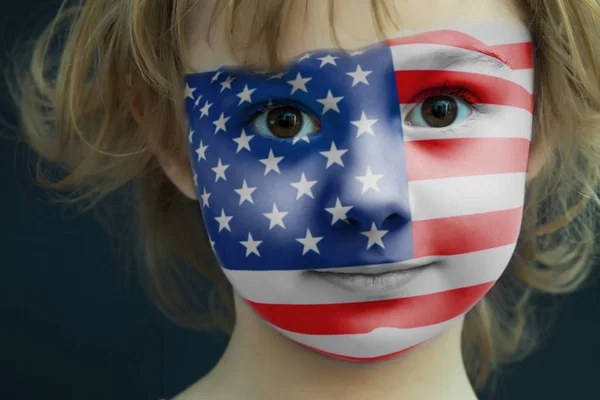 Portrait of a child with a painted American flag Royalty Free Stock Photos