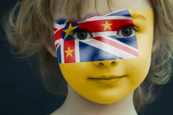 Portrait of a child with a painted Niue flag — Stock Photo, Image