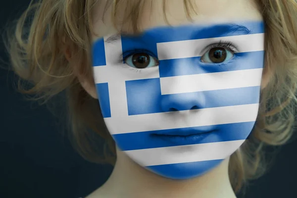 Child with a painted flag of Greece — Stock Photo, Image