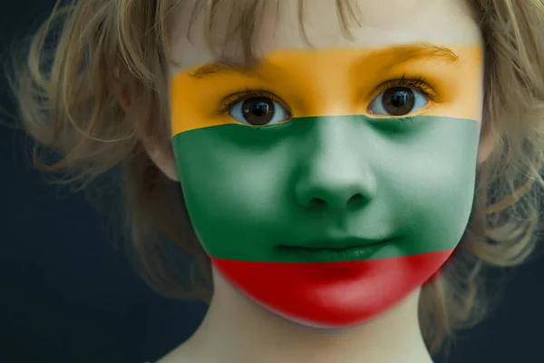 Child with a painted flag of Lithuania — Stock Photo, Image