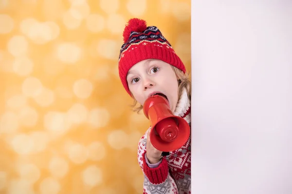 Little girl shouts something into the megaphone — Stock Photo, Image