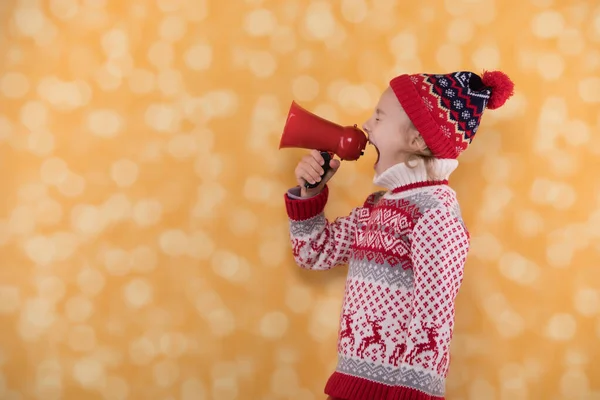 Little girl shouts something into the megaphone — Stock Photo, Image