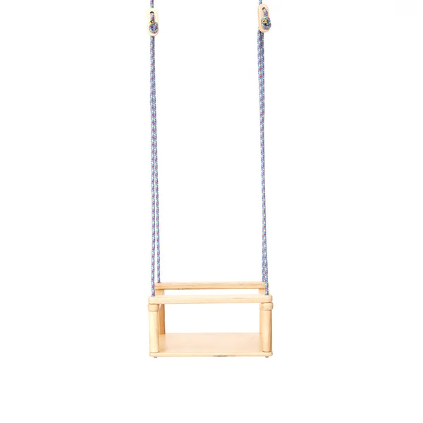 Childrens swing fixed on the ropes on the white . — Stockfoto