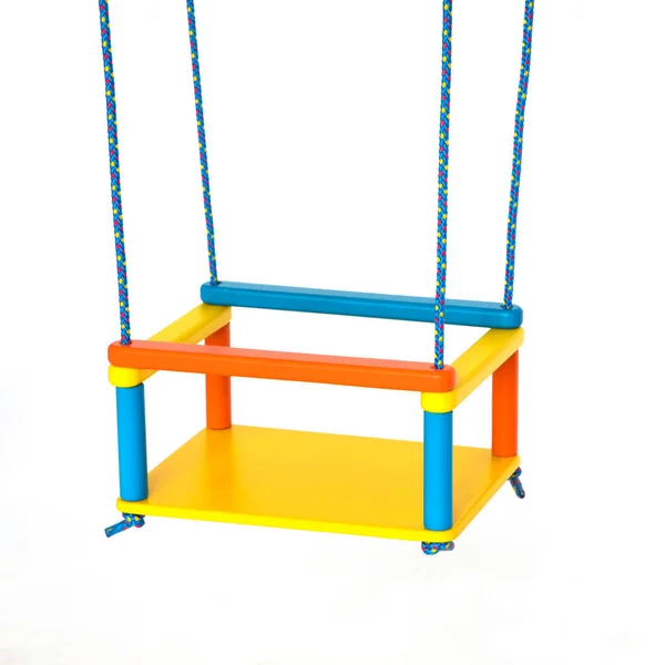 Childrens swing fixed on the ropes against the white — Stockfoto