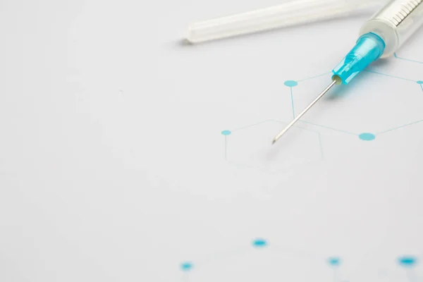 Medical syringe on the science background — 스톡 사진