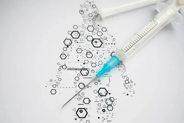 Medical syringe on the science background — ストック写真