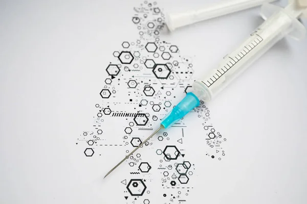 Medical syringe on the science background — Stok fotoğraf