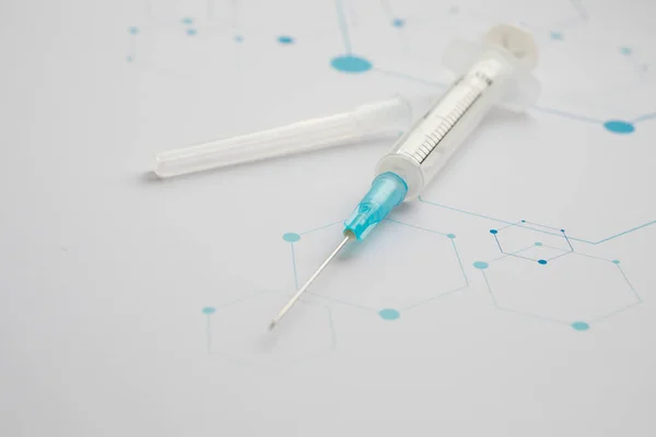 Medical syringe on the science background — 스톡 사진