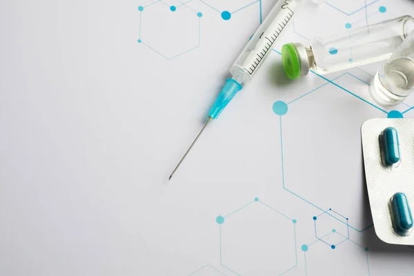 Ampoules and syringe on the science background — 스톡 사진
