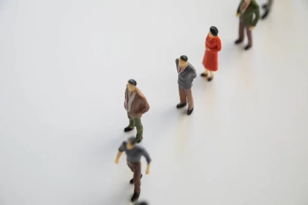 Toy, miniature figures of human in costumes. — Stock Photo, Image