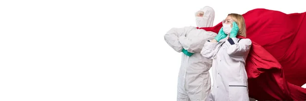 Woman and man doctors in superhero suits standing on defense from virus pandemic. — Stock Photo, Image