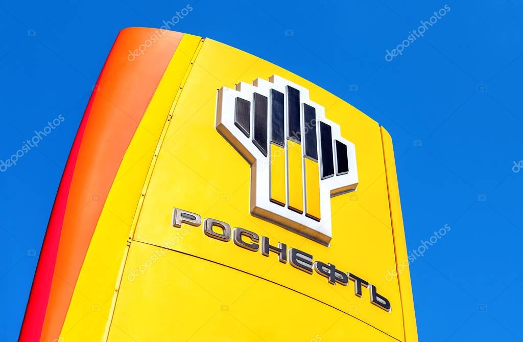 SAMARA, RUSSIA - APRIL 16, 2016: The emblem of the oil company Rosneft against the blue sky background. Rosneft is one of the largest russian oil companies