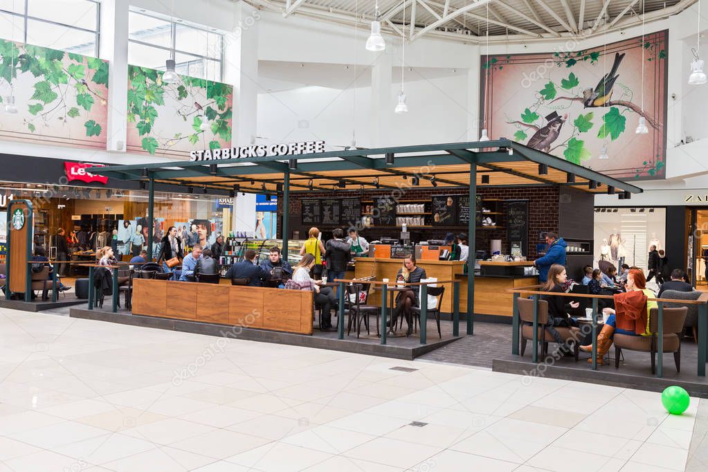Samara, Russia - April 1, 2017: Starbucks cafe interior in Samara shopping center Kosmoport. Starbucks Corporation is an American global coffee company and coffeehouse chain