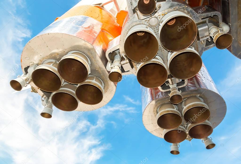Space rocket engines of the russian spacecraft over blue sky bac