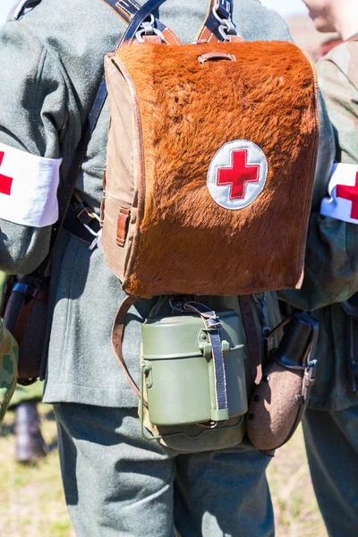 German military paramedic equipment with a red cross brassard an — Stock Photo, Image