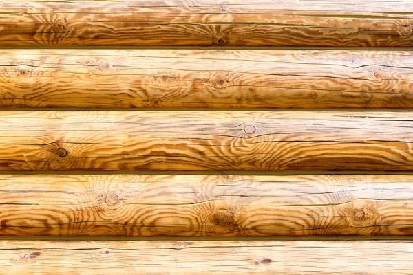 Parede de madeira de logs como textura de fundo — Fotografia de Stock