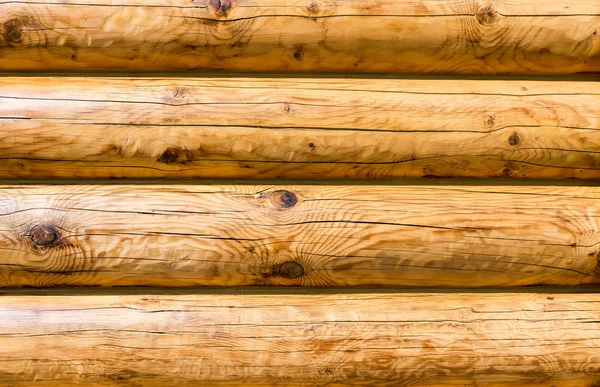 Wooden wall from logs as background texture — Stock Photo, Image