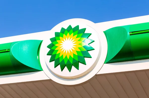 BP British Petroleum petrol station logo over blue sky. Britis Stock