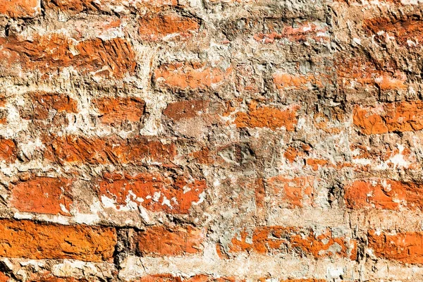 Antigua pared de ladrillo rojo grunge resistido como fondo — Foto de Stock