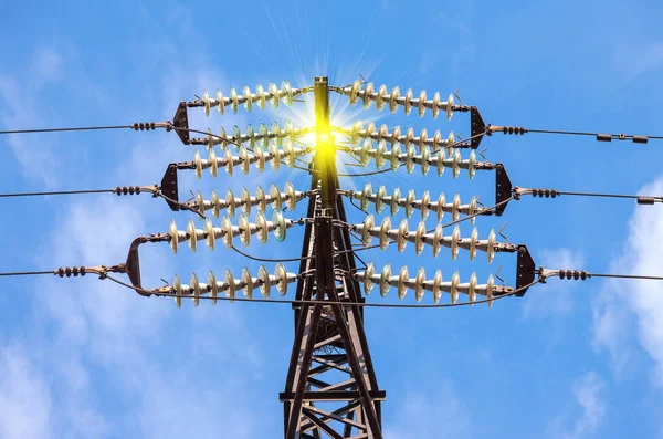 High voltage electric tower against the blue sky. Power transmis — Stock Photo, Image