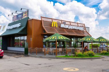 McDonald's fast food restaurant in summer day clipart